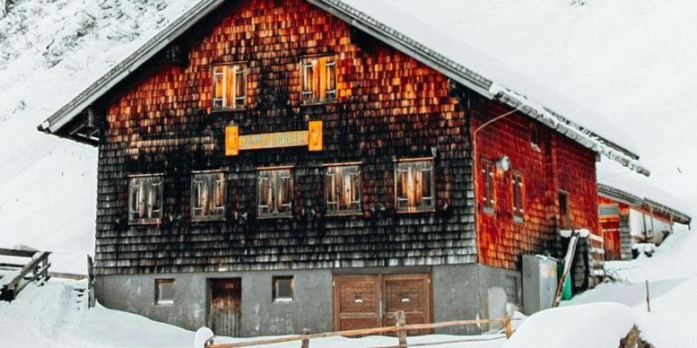 Snow-covered rustic wooden chalet. One of many beautiful properties available for a new kind of ownership with RWAs.